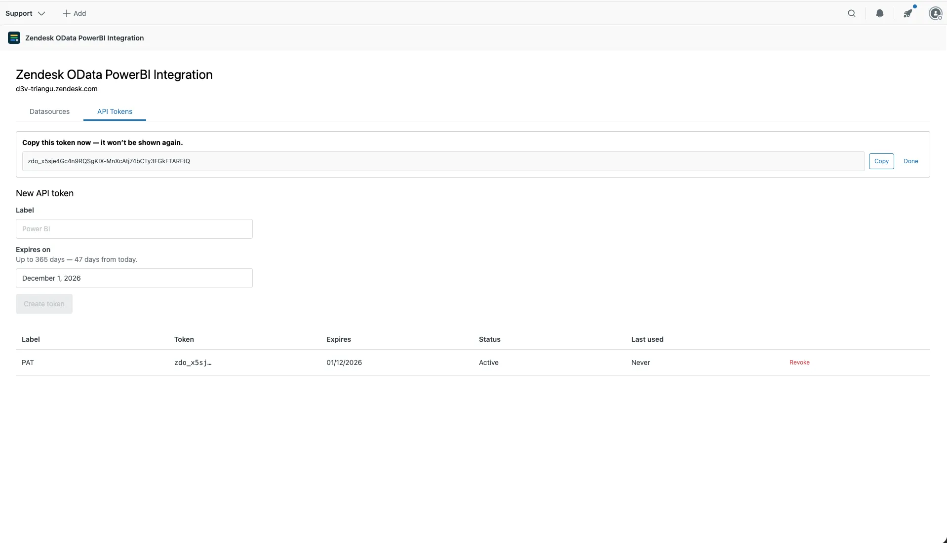 A newly created token shown once with a Copy button, and the token list below